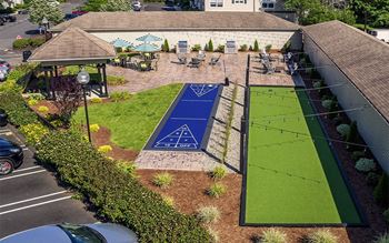 A tennis court is shown on the side of a building