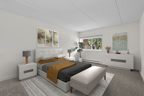 Clifton Park apartment for rent - Bedroom with tufted headboard and modern furnishings at The Crossings at Halfmoon Apartments, Clifton Park, New York