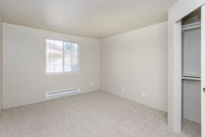 Olympia apartment for rent - an empty bedroom with a window and a closet