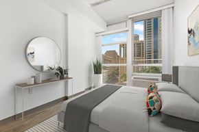 Honolulu apartment for rent - a bedroom with a bed and a city view