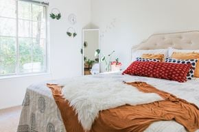 Ferndale apartment for rent - a bedroom with a bed and pillows and a window