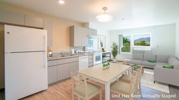 Walanae apartment for rent - A modern kitchen with a dining table and chairs.
