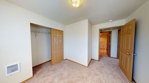 Bellingham apartment for rent - a bedroom with two closets and a door to a hallway