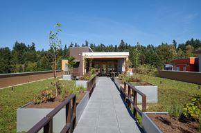 Kirkland apartment for rent - A modern building with a walkway leading to the entrance.