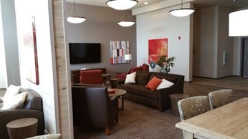 Everett apartment for rent - a living room with couches and chairs and a table