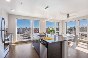 Seattle apartment for rent - a kitchen and dining area with a large counter and windows