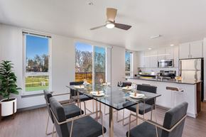 Seattle apartment for rent - a dining room with a glass table and chairs
