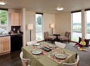 Bellevue apartment for rent - A dining room with a table set for a meal.