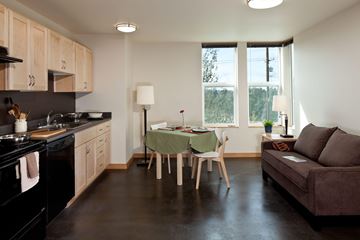 Bellevue apartment for rent - A kitchen with a table and chairs in the middle of the room.