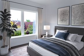 Seattle townhouse for rent - a bedroom with a bed and a large window