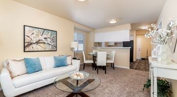 Bellingham apartment for rent - A living room with a white couch and a glass coffee table.