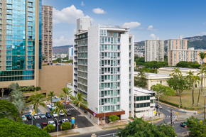 Honolulu apartment for rent - an aerial view of a building in a city with tall buildings