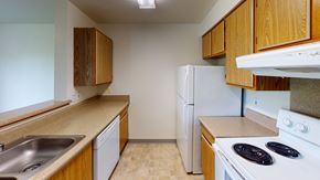 Bellingham apartment for rent - an empty kitchen with a stove refrigerator and sink