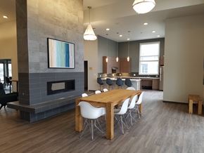 Auburn apartment for rent - a dining room with a table and chairs and a fireplace