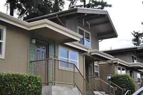 Bellevue apartment for rent - A house with a green door and a brown railing.