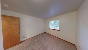 Bellingham apartment for rent - an empty room with a wooden door and a window