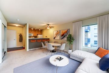 Seattle apartment for rent - a living room with a couch and a table