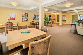 Auburn apartment for rent - a dining room with tables and chairs and a couch