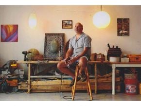 Everett apartment for rent - a man sitting on a stool in front of a table