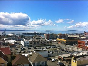 Everett apartment for rent - a cityscape with buildings and a body of water in the background