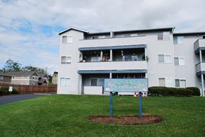 Ferndale apartment for rent - an apartment building with a sign in front of it