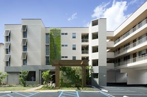 Honolulu apartment for rent - a rendering of the exterior of a building with greenery on it