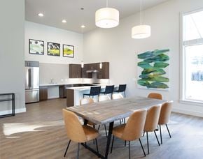 Arlington apartment for rent - a dining room and kitchen with a wooden table and chairs
