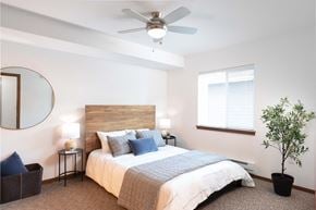 Arlington apartment for rent - a bedroom with a bed and a ceiling fan
