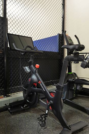 High-end fitness center offering free weights, yoga, and top of the line cardio equipment including a peloton