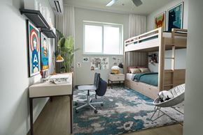 Kapolei apartment for rent - A room with a bunk bed, a desk, and a chair.