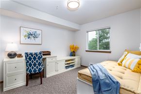 Lacey apartment for rent - a bedroom with a bed and a desk and a window