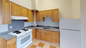 Bellingham apartment for rent - an empty kitchen with a stove refrigerator and sink