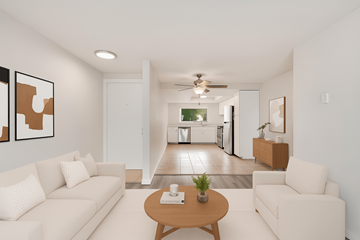 Burien apartment for rent - A living room with a white couch and a coffee table.