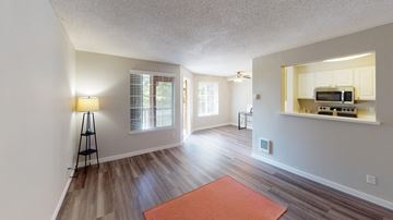 Federal Way apartment for rent - A living room with a red rug on the floor.