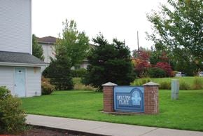 Bellingham apartment for rent - A sign that says "Orleans Place" is in front of a grassy area.