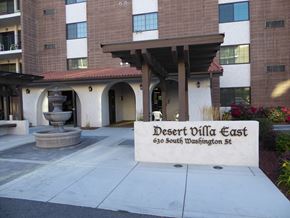 Kennewick apartment for rent - the entrance to the desert villa east building with a fountain in the courtyard