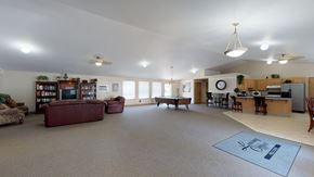 Bellingham apartment for rent - A spacious living room with a couch, a television, and a dining area.