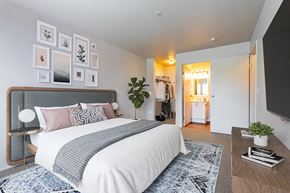 Bremerton apartment for rent - a bedroom with a bed and a tv