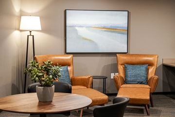 Lacey apartment for rent - a living room with a table and chairs and a painting on the wall