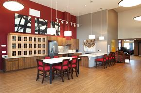 Renton apartment for rent - an open kitchen and dining room with a table and chairs