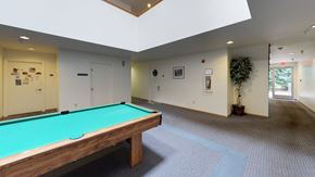 Lynden apartment for rent - a pool table in a room with white walls