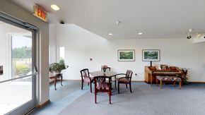 Lynden apartment for rent - a dining room with a table and chairs and a piano