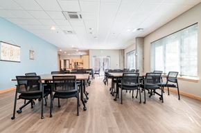 Bothell apartment for rent - A conference room with a long table and chairs.
