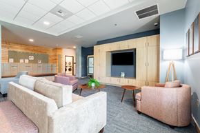 Bothell apartment for rent - A living room with a couch, chair, and a television.