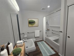 Waipahu apartment for rent - A bathroom with a white tub and a white towel hanging on the wall.