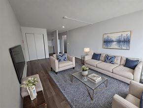 Waipahu apartment for rent - A living room with a couch, chairs, and a coffee table.
