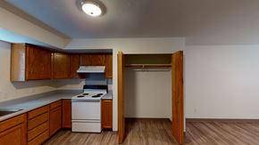 Bellingham apartment for rent - a kitchen with white appliances and wooden cabinets and a refrigerator