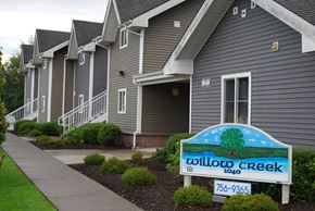 Bellingham apartment for rent - a street sign in front of a row of grey houses
