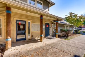 Sammamish apartment for rent - A building with a blue door and a red sign on the window.