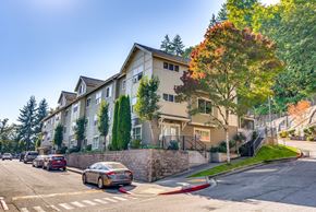 Issaquah apartment for rent - A row of houses with a tree in front of them.